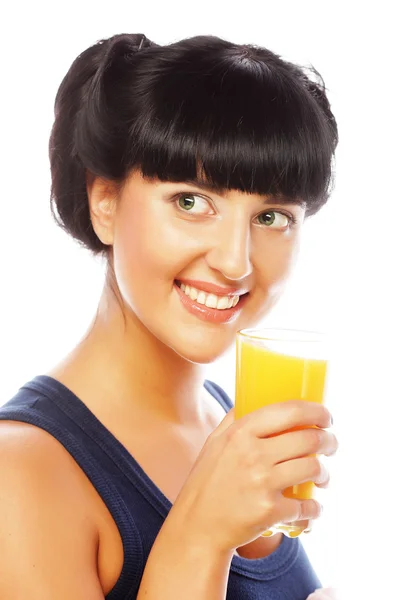 Brunette woman holding orange juice — Stock Photo, Image