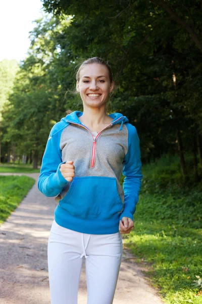 Pretty young girl runner in the forest. — Stock Photo, Image