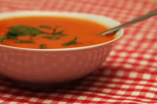 Closeup of a bowl with pumpkin soup — Stock Photo, Image