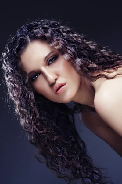 Beautiful woman with long curly hairs — Stock Photo, Image