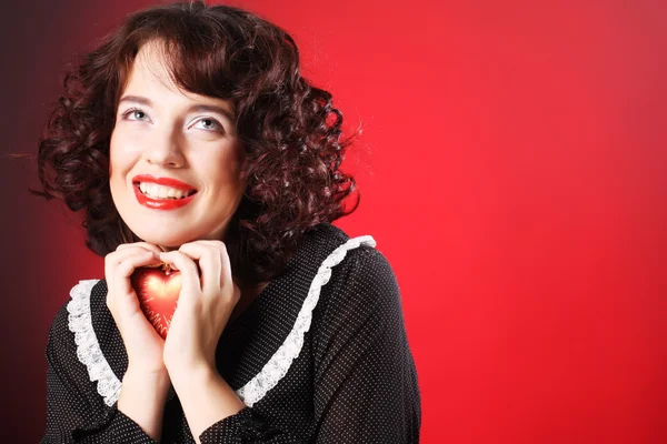 Woman holding red heart — Stock Photo, Image