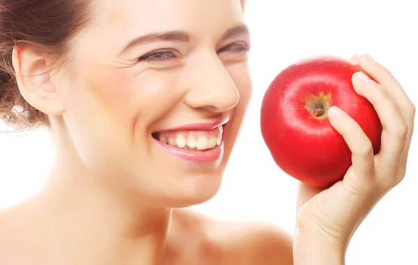 Brünette Frau mit rotem Apfel — Stockfoto