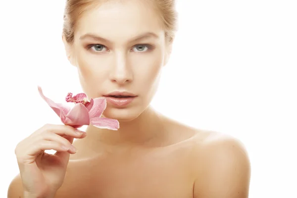 Woman with pink orchid — Stock Photo, Image