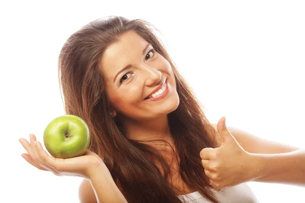 Femme avec pomme verte et montrant pouce vers le haut — Photo