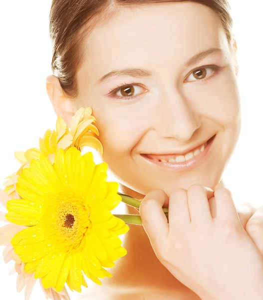 Young woman with gerber flower — Stock Photo, Image