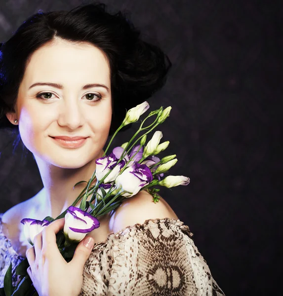 Beautiful woman with lilac flower — Stock Photo, Image