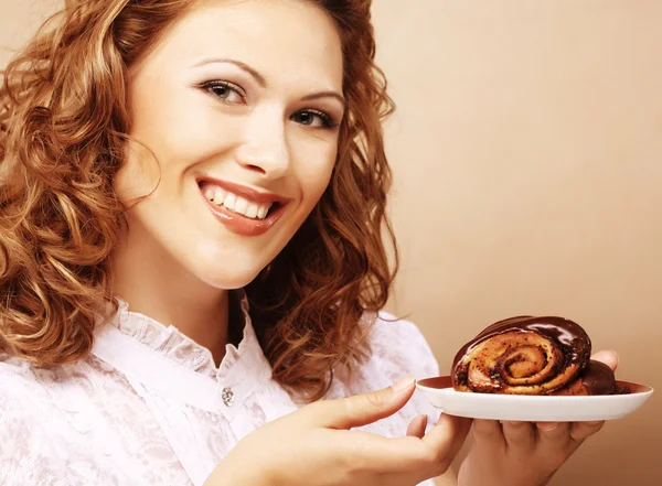 Laughing woman with cake — Stock Photo, Image