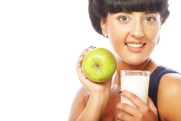 Woman with apple and milk — Stock Photo, Image
