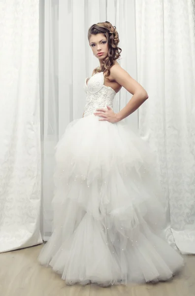 Happy bride posing in hotel room — Stock Photo, Image