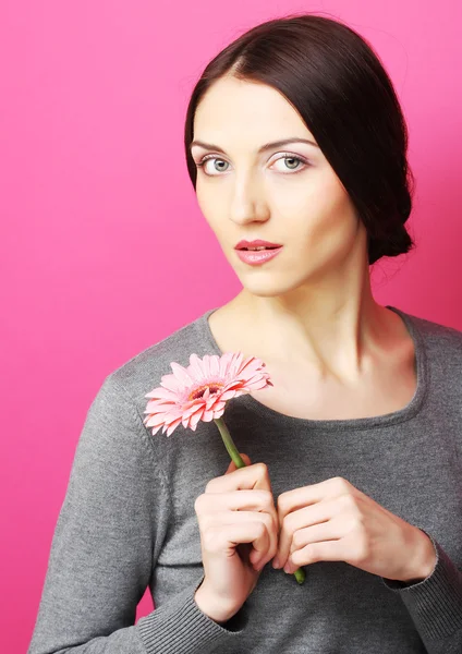 Brunette woman with flowers — Stock Photo, Image