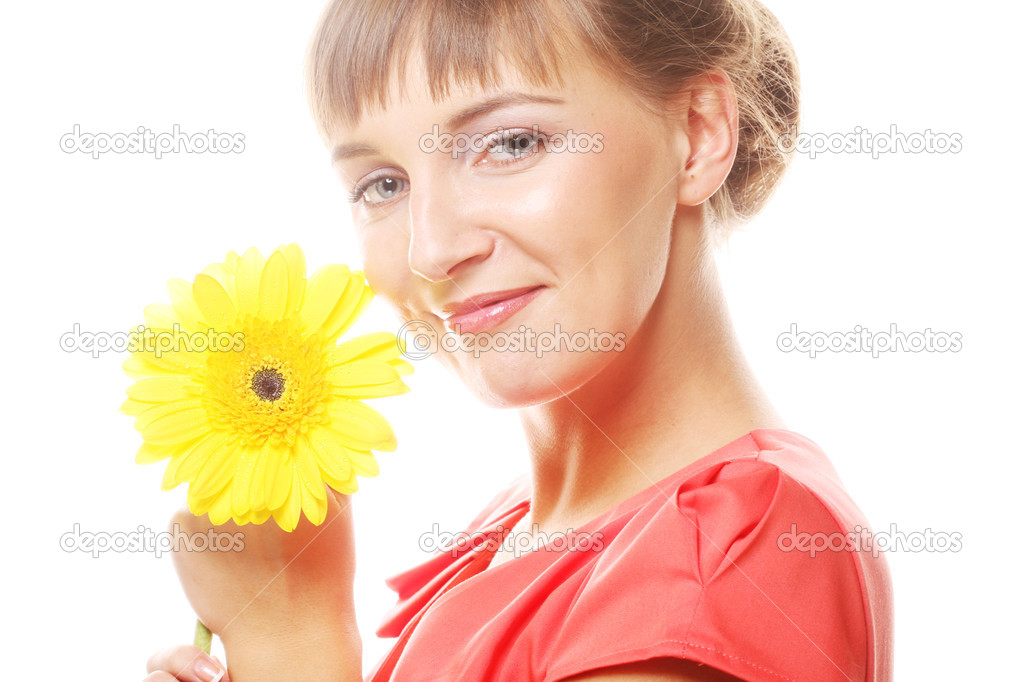 Beautiful young woman with gerber flower