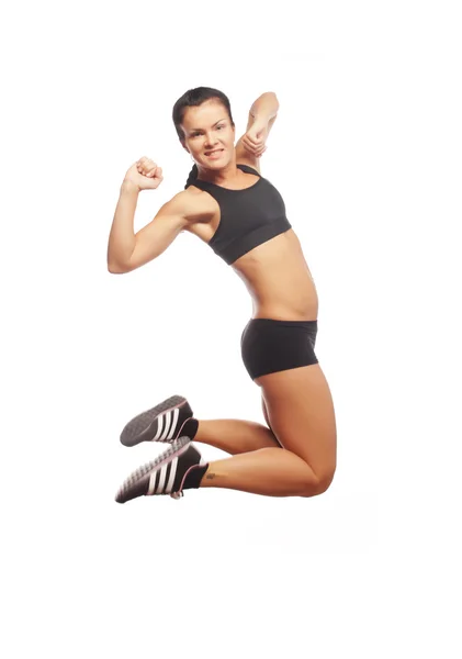 Fitness žena skákání radosti. — Stock fotografie