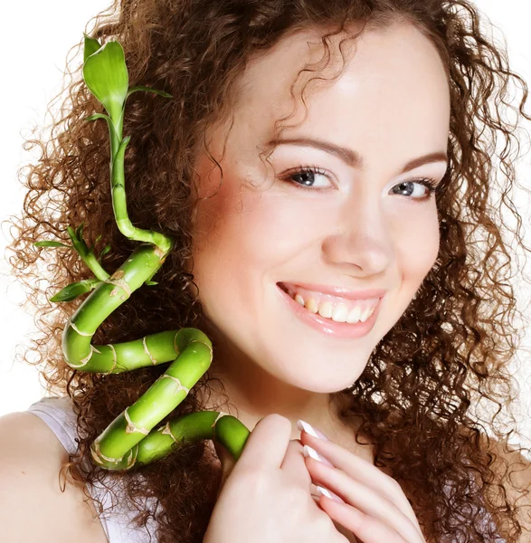 SPA. young woman with bamboo. — Stock Photo, Image