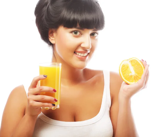 Brunette woman holding orange juice — Stock Photo, Image