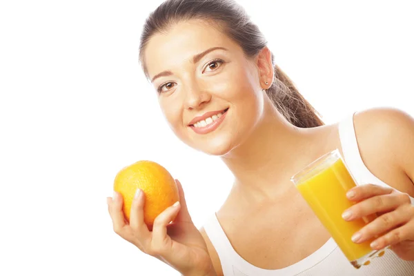 Young happy woman drinking orange juice. Stock Picture