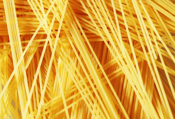 Rohe Pasta als ganzer Hintergrund — Stockfoto