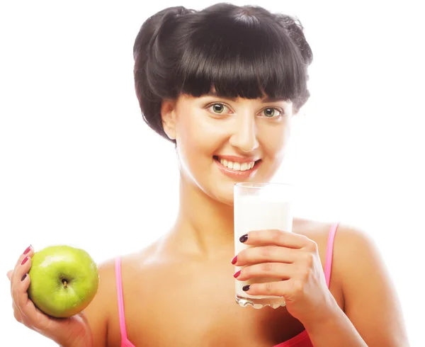 Woman with apple and milk — Stock Photo, Image