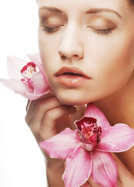 Beautiful woman with pink flower — Stock Photo, Image