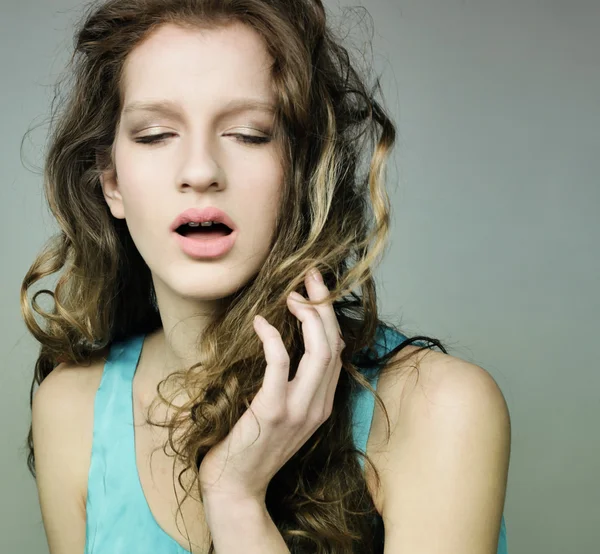 Woman with beautiful long blond curly hairs — Stock Photo, Image