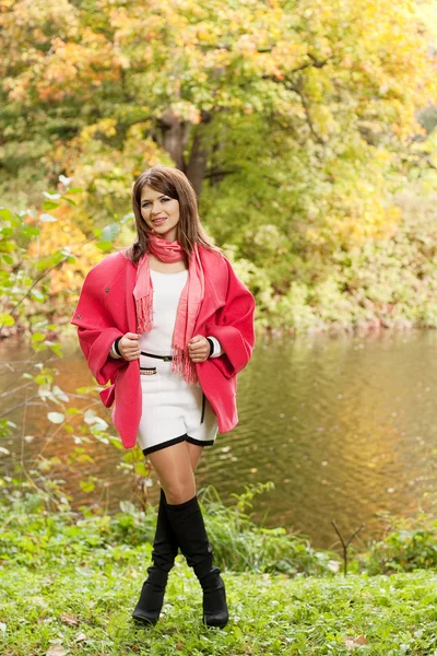 Woman near the river in autumn season — Stock Photo, Image