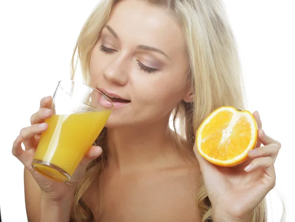 Young happy woman drinking orange juice. — Stock Photo, Image