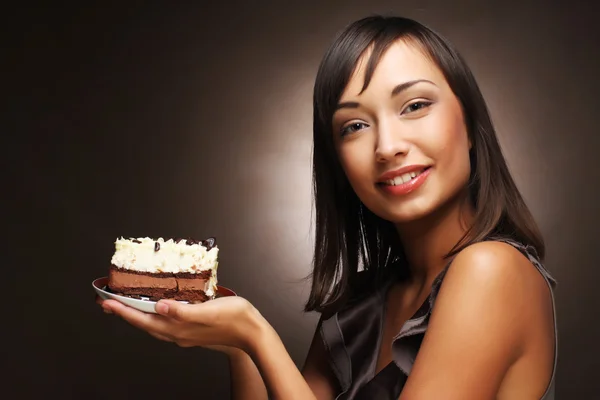 Beautiful young woman with a cake — Stock Photo, Image