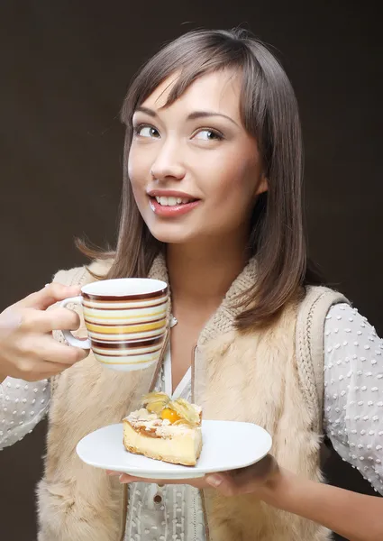 Attractive woman with coffee and dessert — Stock Photo, Image