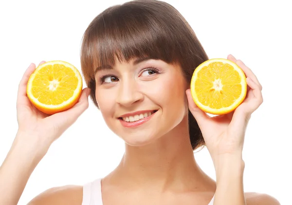 Young cheerful woman with oranges — Stock Photo, Image