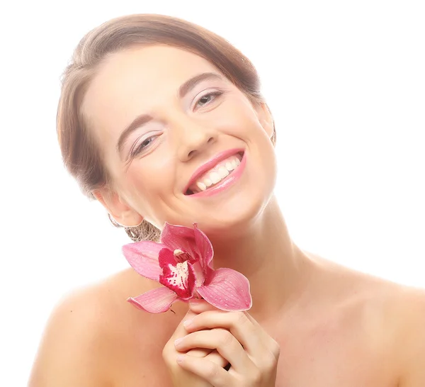 Schöne Frau mit rosa Blume — Stockfoto