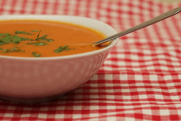 Closeup of a bowl with pumpkin soup — Stock Photo, Image