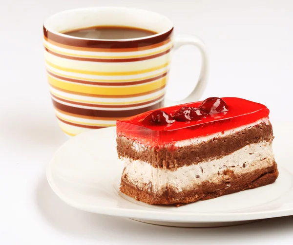 Pastel con una taza de café — Foto de Stock