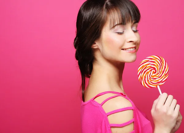 Pretty woman with lollipop — Stock Photo, Image