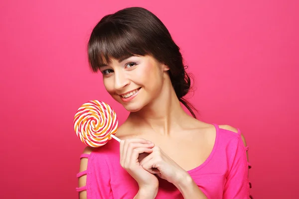 Pretty woman with lollipop — Stock Photo, Image