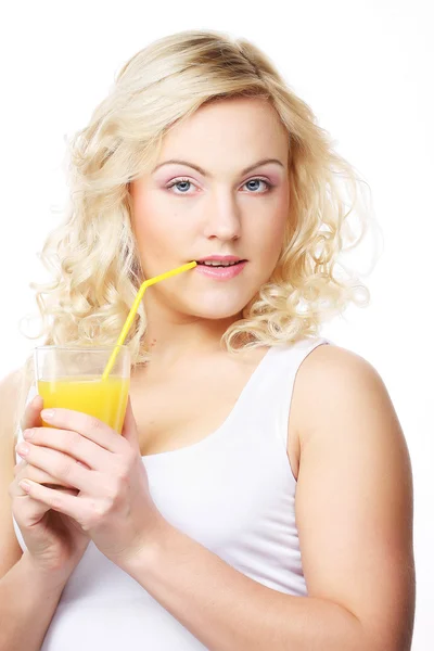 Young happy woman drinking orange juice. — Stock Photo, Image