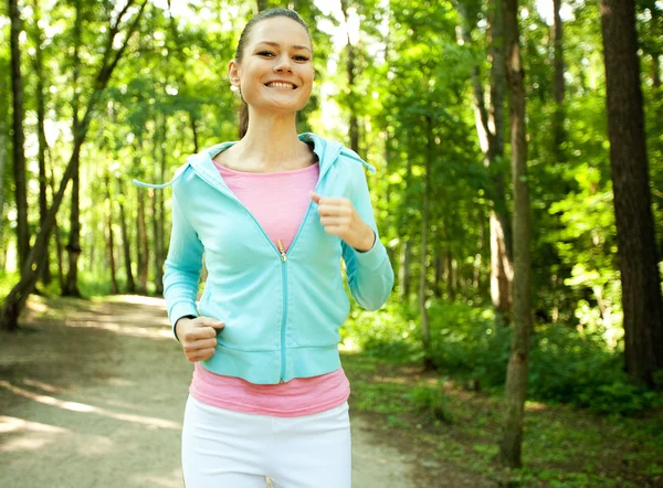 Pretty young girl runner in the forest. — Stock Photo, Image