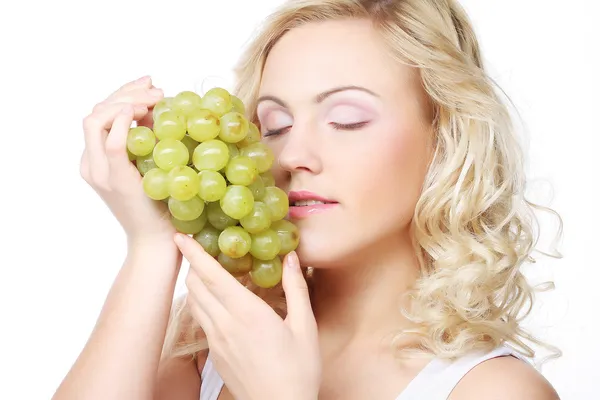 Blond woman holding a bunch of grape — Stock Photo, Image