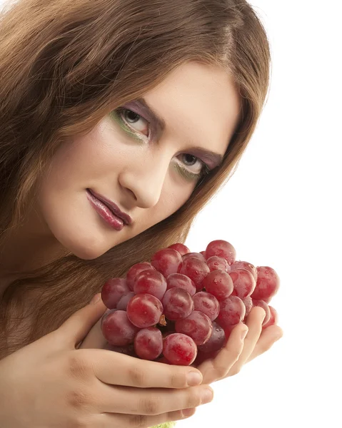 Attractive woman with bunch of grapes Royalty Free Stock Images