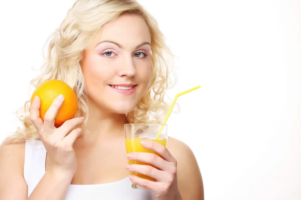 Young happy woman drinking orange juice. — Stock Photo, Image