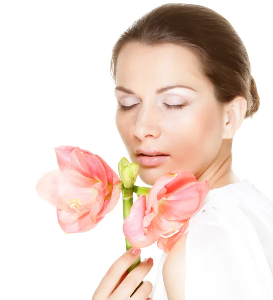 Young girl with cloused eyes holding flower — Stock Photo, Image