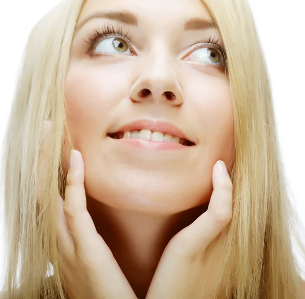 Portrait of a smiling thinking woman looking up — Stock Photo, Image