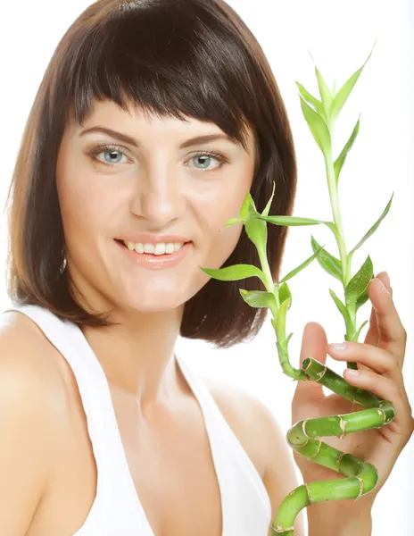 SPA. young woman with bamboo. — Stock Photo, Image