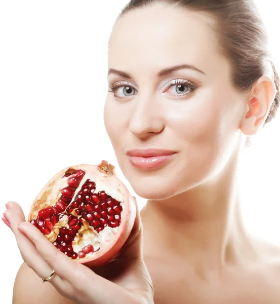 Woman showing pomegranate smiling. — Stock Photo, Image