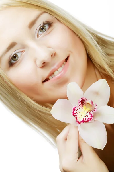 Young beautiful woman with pink flower — Stock Photo, Image