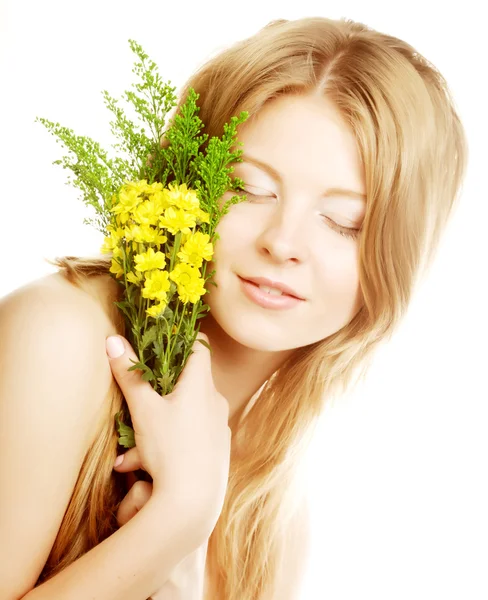 Woman with small yellow flowers — Stock Photo, Image