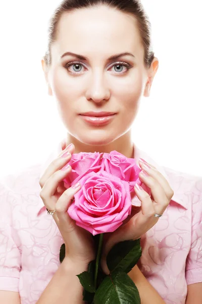 Žena s růžovými růžemi — Stock fotografie