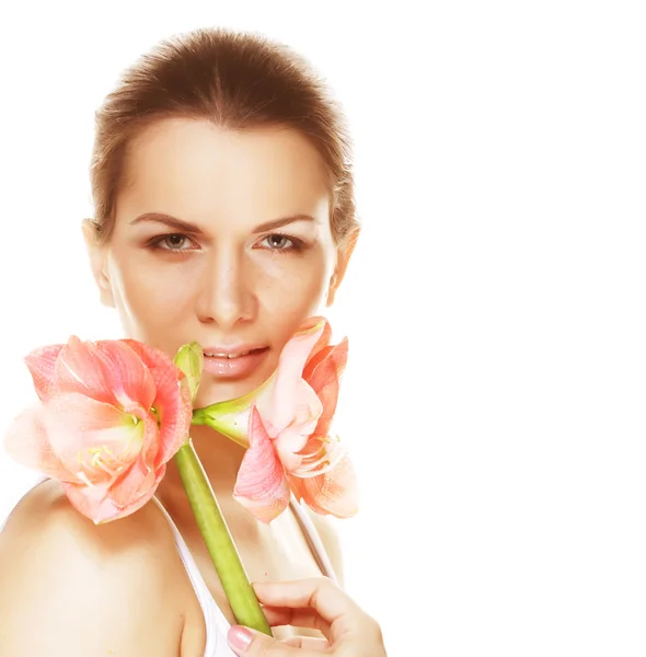 Beautiful woman holding pink flower — Stock Photo, Image