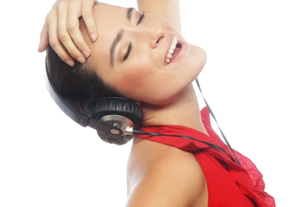 Woman dancing to music with headphones — Stock Photo, Image