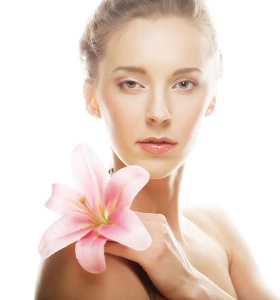 Beauty face of the young woman with pink lily — Stock Photo, Image