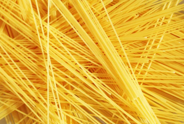 Rohe Pasta als ganzer Hintergrund — Stockfoto