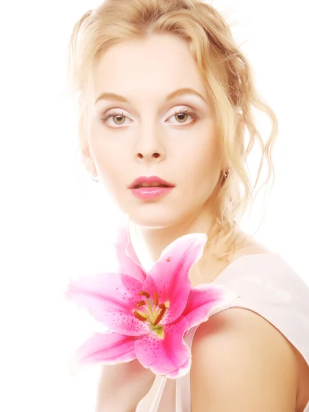 Woman with pink lily high-key portrait — Stock Photo, Image